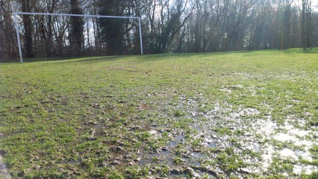 A waterlogged football pitch at Tilekiln in St Leonards on Saturday (SUS-150221-210859002)