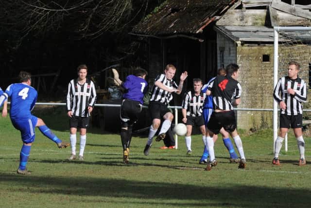 Goalmouth action from the Midhurst-Wick and Barnham game   Picture by Kate Shmilt C150339-2