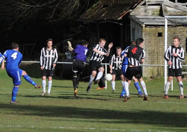 Goalmouth action from the Midhurst-Wick and Barnham game   Picture by Kate Shmilt C150339-2