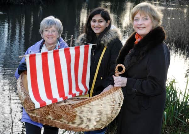 JPCT 280115 S15040638x Horsham. Interfaith minister Jean Francis has a three foot Viking boat that was traditionally used as part of a funeral ceremony. Pictured with Jill Shuker and Naina Kolhe -photo by Steve Cobb SUS-150128-144547001
