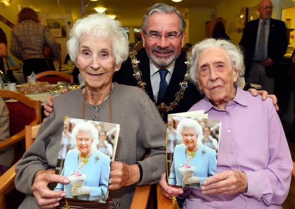 Irene Godfrey and  Ethel Brown celebrate their 100th birthdays with the mayor of Worthing Vic Walker Picture: Liz Pearce