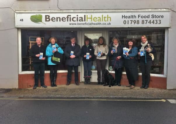 Local shop owners and managers who support Fairtrade and feature in the directory with Pulborough Fairtrade Group member Rosemary Russell, second from left SUS-150224-103144001