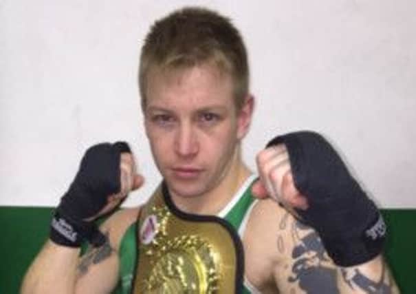 Shaun Attrell, of West Hill Boxing Club, sporting the under-69kg Southern Counties Championship belt