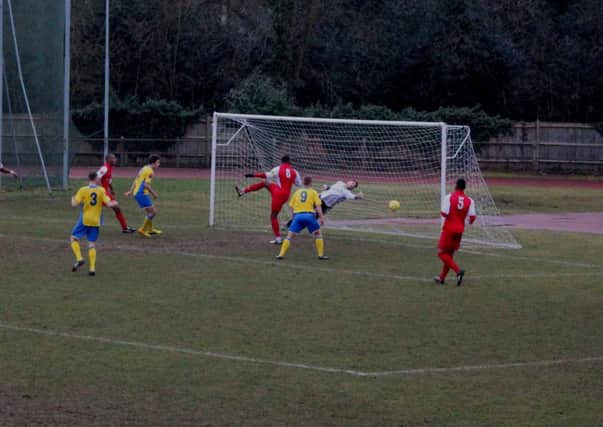Lee Harding heads the opening goal for Burgess Hill. Picture by Colin Bowman