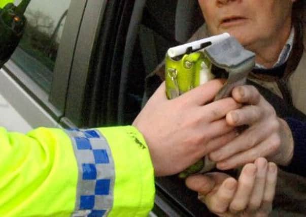 File photo dated 30/11/06 of a motorist being given a breath test by police. PRESS ASSOCIATION Photo. Issue date: Friday June 1, 2012. Police have launched a summer anti-drink-drive campaign warning motorists they face checks in the morning as well as at night-time. The month-long campaign by the Association of Chief Police Officers (Acpo) will also target those who take drugs and then drive. Acpo said tests will be carried out at all times of the day and night, including first thing in the morning. During last year's campaign, which also ran in June, 88,629 people were stopped and breath-tested, with 6.1% testing positive or refusing a test. See PA story TRANSPORT Drink Campaign. Photo credit should read: John Giles/PA Wire ENGPPP00120130412172137