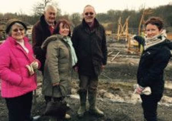 Councillors Kate Rowbottom, Ian Howard, Claire Vickers and Jonathan Chowen are shown the latest progress on the Dinosaur Island site at Southwater Countryside Park by Countryside Officer Anna Chapman.