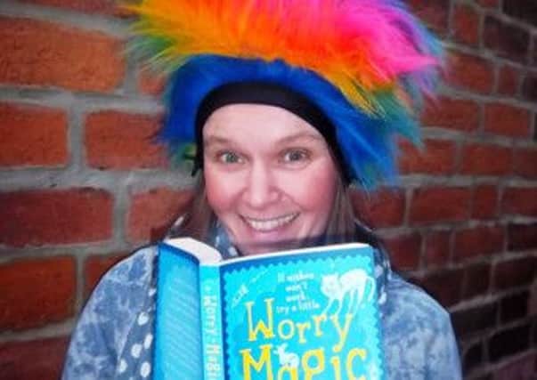Author Dawn McNiff wears a worry wig to launch her new book, Worry Magic