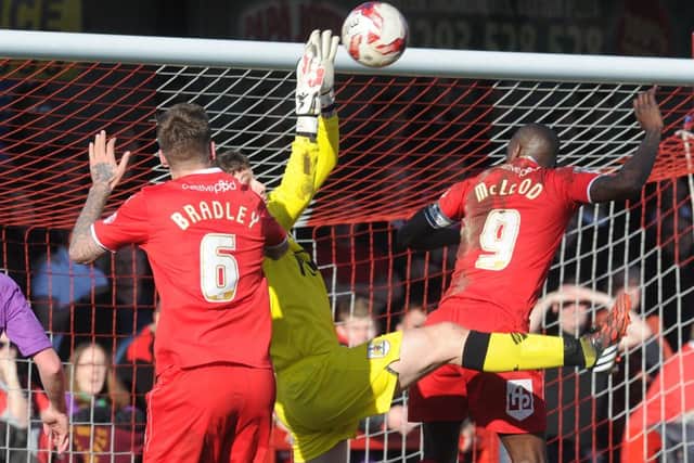 Sonny Bradley and Izale McLeod put the pressure on the Bristol City goal (Pic by Joe & James Rigby) SUS-150703-212821002