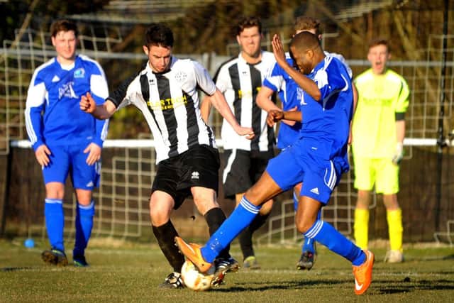 Jamie Weston with Aaron Walsh in background. County League Division 1: St Francis Rangers v Broadbridge Heath (blue). 07-03-15. Pic Steve Robards SUS-150903-161900001