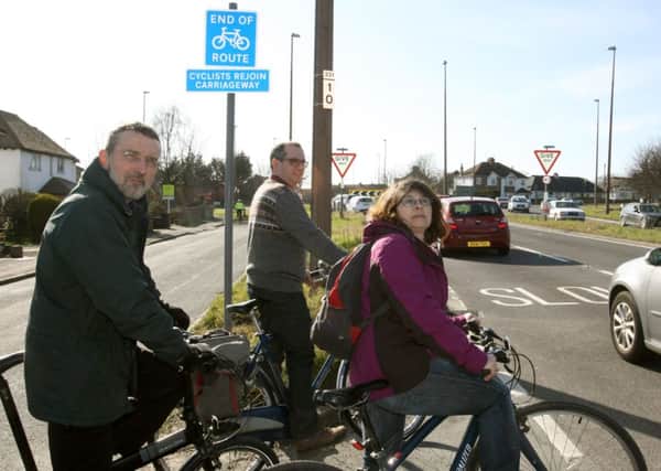 LH 060315 Two residents who cycle are not happy with the new cycle/pedestrian rout, Old Shoreham Road , Lancing. L to R Mike Croker, Anthony Cartmell and Sally Jordan.  Photo by Derek Martin SUS-150603-174232001