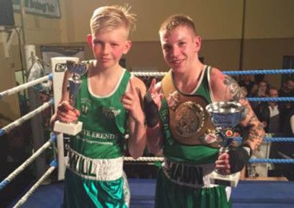 William Badrock and Shaun Attrell proudly clutch their awards at West Hill Boxing Club's show