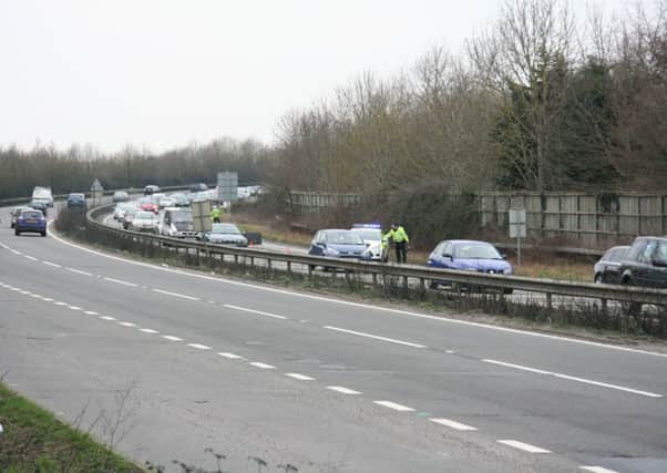 Cars queue to Fishbourne roundabout after one lane closed due to an accident