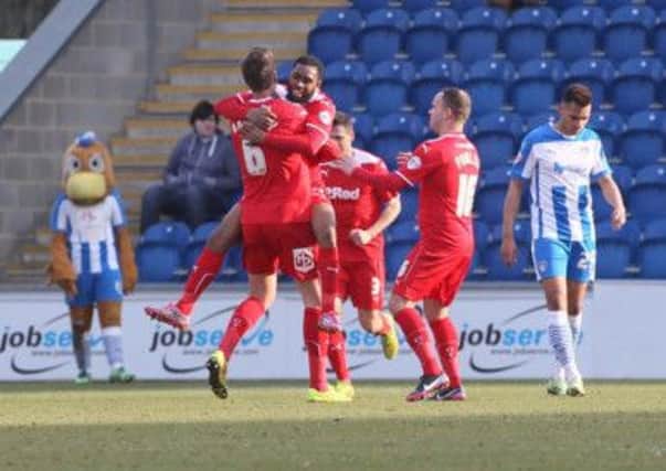 Crawley Town players celebrate a goal againbsty Colchester United SUS-150316-124327002