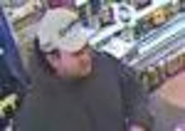Police want to speak to this man in conncection with a wallet theft in Tarring