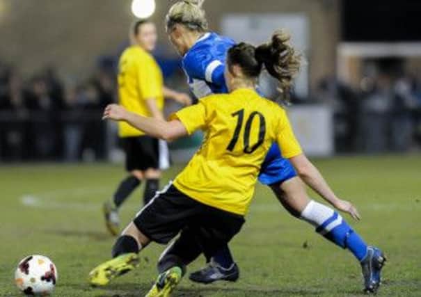 Chichester, in yellow, take on Brighton in the Sussex Cup final  Picture by Dave Burt