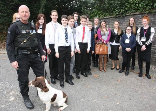 WH 140315  Pupils from Durrington High School and a police dog handler