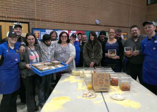 Domino's takeaway chefs visit ARK Horsham charity to teach them how to make pizza - picture by Anna Coe