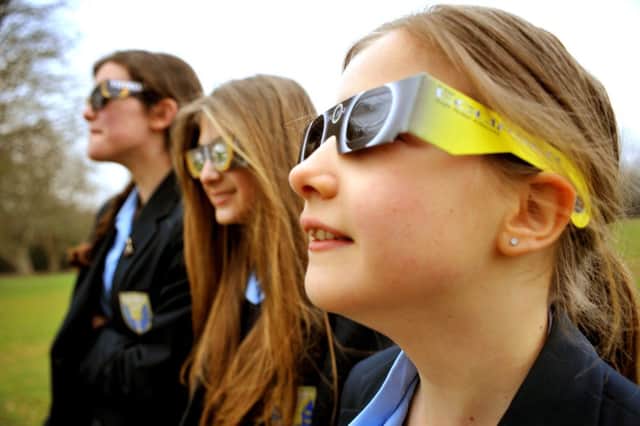 Pupils at Warden Park School, Cuckfield viewing the eclipse. Pic Steve Robards SUS-150320-105355001