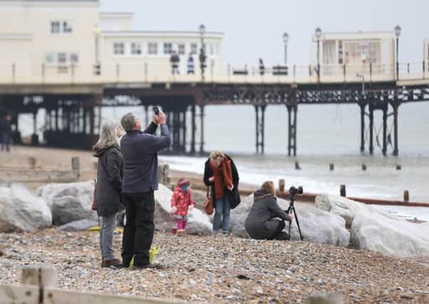 People watching the eclipse on Worthing beach. Photo by Eddie Mitchell