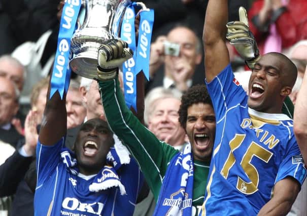 David James, centre, celebrates lifting the Cup in 2008