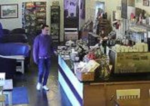 CCTV in Arundel of the man who stole cash from a till in one of the town's cafés SUS-150324-125533001