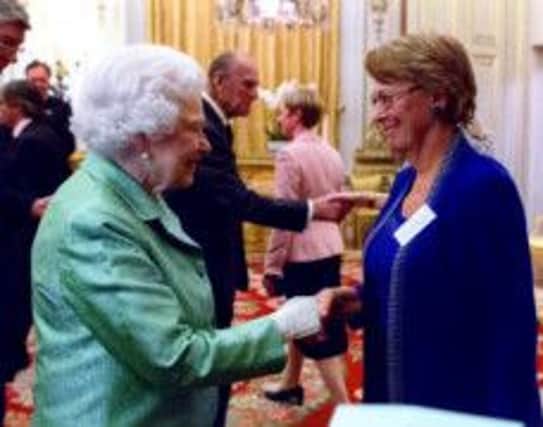 Churchill Fellow Sue Pegler has met HRH The Queen at Buckingham Palace SUS-150330-141625001
