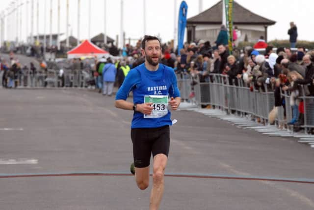 Jeff Pyrah comes home to finish third in the Hastings Half Marathon on Sunday. Picture by Steve Hunnisett (SUS-150322-163056001)