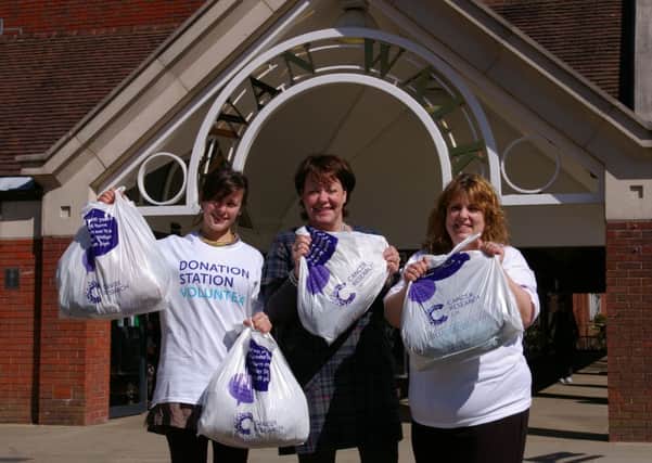 Cancer Research UK Donation Station volunteers with Swan Walk centre manager Gill Buchanan (middle) SUS-150704-132202001