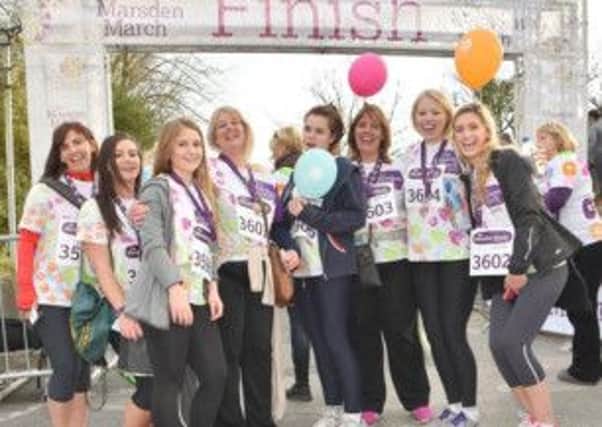 'Jean's Girls' celebrate at the finish line of the 14-mile Marsden March