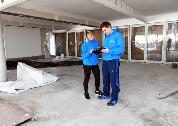 Beach Green Cafe. Beach Green Cafe building which is approaching its official opening this summer. Ongoing building work. Pictured are Kate Radford and Paul Crane in  from Beachfit, which is opening its new gym within the building.   Lancing. 170215. Picture: Liz Pearce 
LP1500067 SUS-150217-194106008