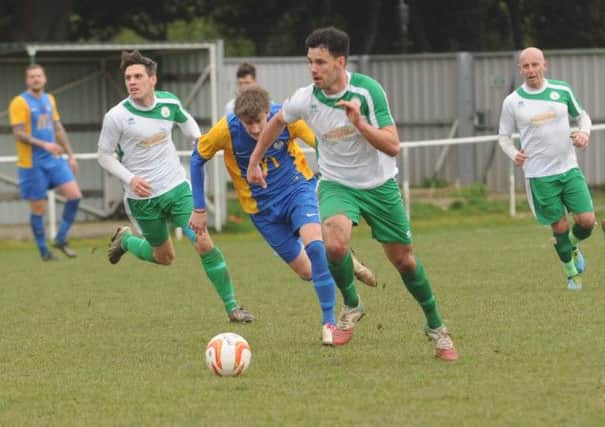 Michael Frangou, Josh Case and Daren Pearce in action for City against Eastbourne  Picture by Louise Adams
