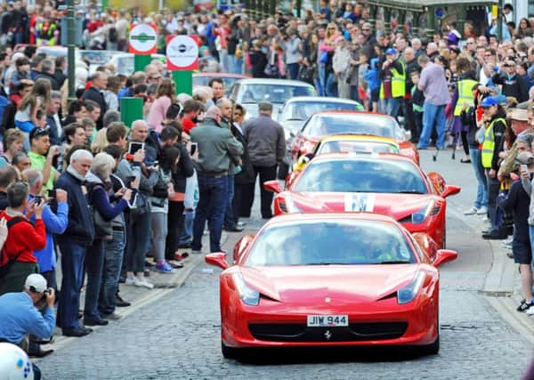 Vintage Ferrari cars parade in Carfax -photo by Steve Cobb.