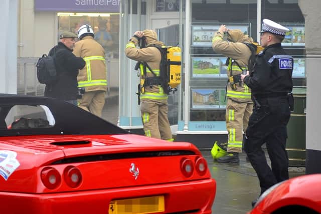 Millions of pounds worth of Ferrari's in fire drama at Horsham Piazza. 03/04/15. Pic Steve Robards SUS-150304-143752001