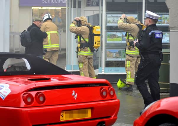 Millions of pounds worth of Ferrari's in fire drama at Horsham Piazza. 03/04/15. Pic Steve Robards SUS-150304-143752001