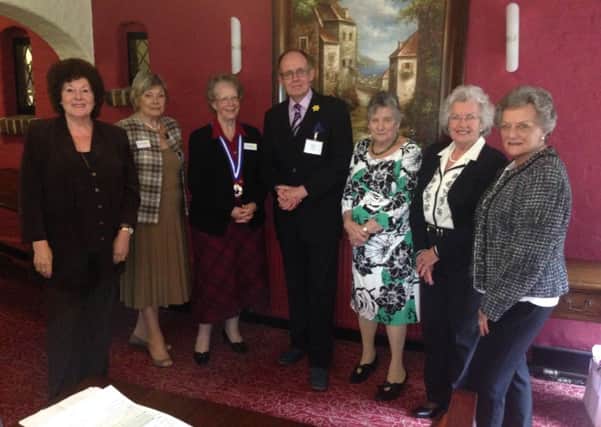 Mark Perry Nash with the Fryern Ladies Probus committee. Picture by Simon Green - General Manager of The Roundabout Hotel SUS-150704-122819001