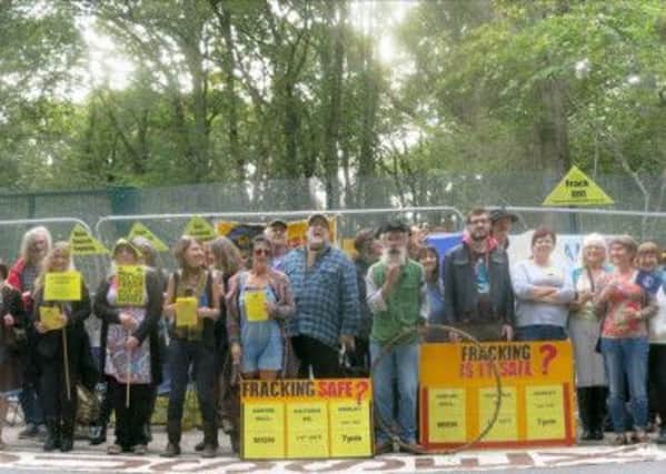 Campaigners from Frack Free Surrey staged a peaceful protest at Horse Hill, Horley SUS-141016-173535001