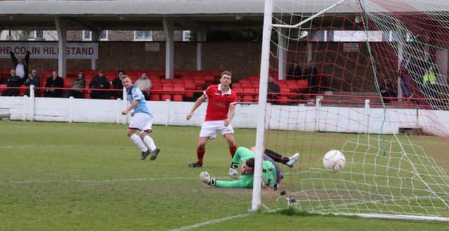 Sam Adams scores Hastings United's winning goal away to Ramsgate on Easter Monday. Picture courtesy Scott White