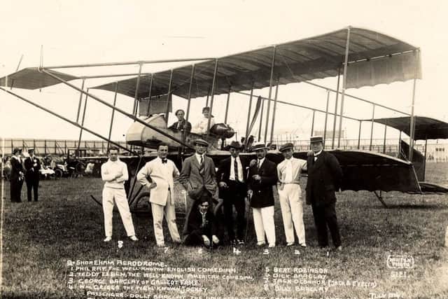 Cecil Pashley in the cockpit of the aeroplane, surrounded by celebrities of the day, c1914. On the right is Phil Ray, a well-known English comedian; second right, Teddy Elben, a well-known American comedian; fourth right, William Griggs, leading jockey of the day. Passenger is Dolly Barclay, daughter of the music hall star Kate Carney