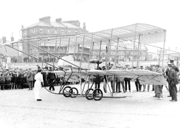 The Carlton and Beaulieu hotels provide the backdrop to the Pashleys Farman bi-plane as the crowds build up, May 26, 1913