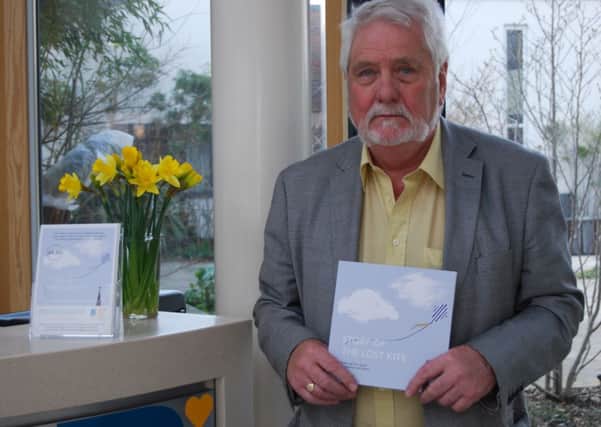 Terry Gould with his third book, Story of the Lost Kite