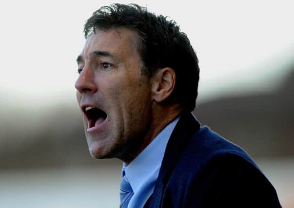 Dean Saunders the new Crawley Town manager watches his side against Colchester (Pic by Jon Rigby) PPP-141228-191524004