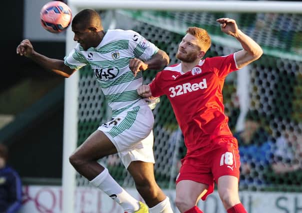 Yeovil Town's Stephen Arthurworrey is tackled by Crawley Town's Matt Harrold PHOTO: - Mandatory by-line: Harry Trump/Pinnacle - Photo Agency Ltd Tel: +44(0)1363 881025 - Mobile:0797 1270 681 - VAT Reg No: 183700120 - 08/11/2014 - FOOTBALL - The FA Cup First Round - Yeovil Town v Crawley Town - Huish Park, Yeovil, Somerset, England. SUS-140911-140145002