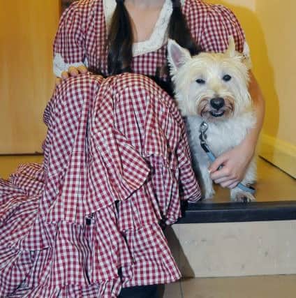 Adrienne Cox stars as Dorothy