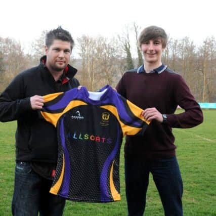 The main sponsor of the U15s, James Anderson from Allsorts Uckfield  presenting one of the tour tops to U15s captain Josh. Picture by Ron Hill