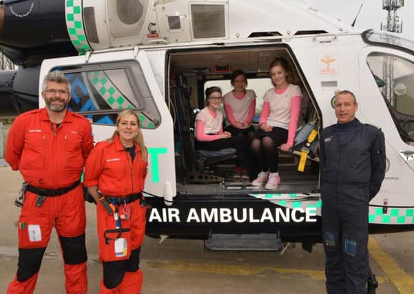 Tegan Poole, Jemima Nash and Harriet Page of the Focus School in Pulborough visit the air ambulance base