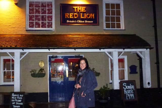 Cathy Price has spent the past four years visiting every Red Lion Pub in the British Isles, plus 10 others abroad. Pictured at the Red Lion in Chelwood Gate - picture submitted