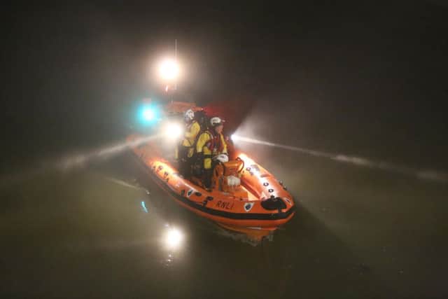 Lifeboat crews conducting a search of the River Arun last night following reports of a person jumping into the river. PHOTO: Eddie Mitchell