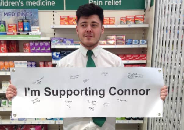 Staff at sainsbury's Horsham sign banner for Connor SUS-150414-105014001