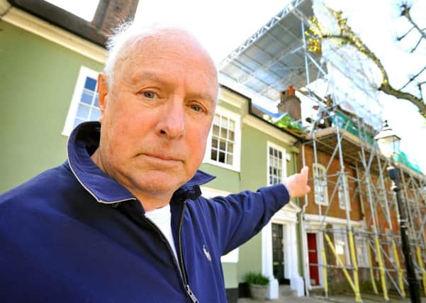 Resident Reg Pyecroft angry about planning approval delays meaning ugly scaffolding has been outside two homes in Horsham Causeway for months. Pic Steve Robards SUS-150428-115251001