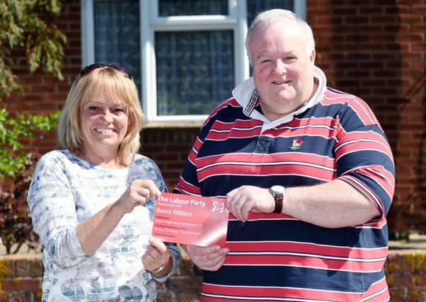 Labour town councillor Mike Northeast presents Berni Millam with her party membership card